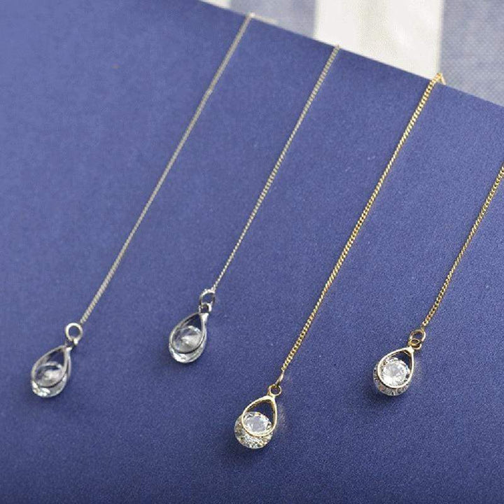 Glamorous long rhinestone drop earrings, elegant dangle jewelry for women's special occasions.