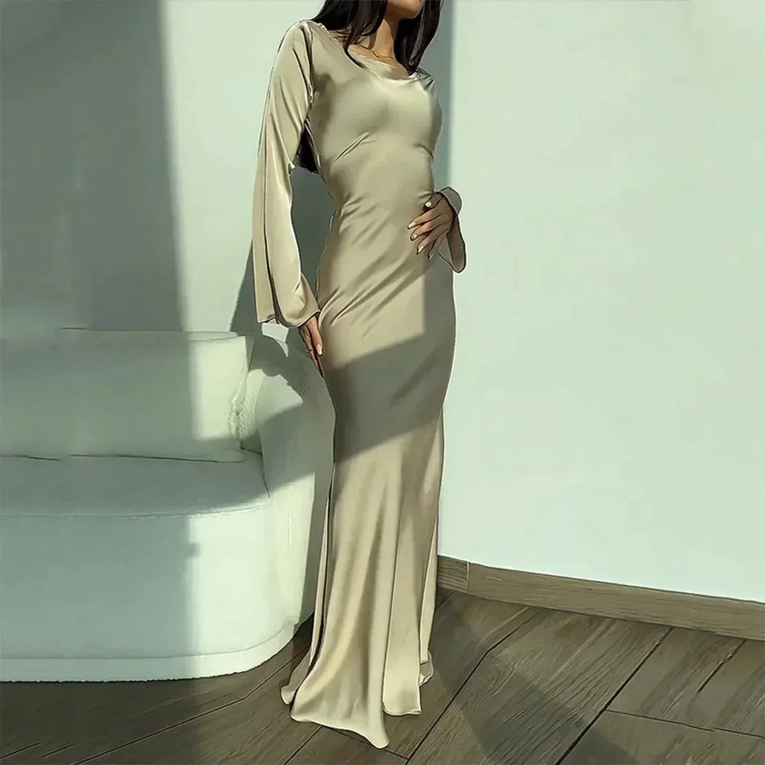 Versatile white women's long sleeve dress, elegant and fitted, suitable as a summer casual or party dress.