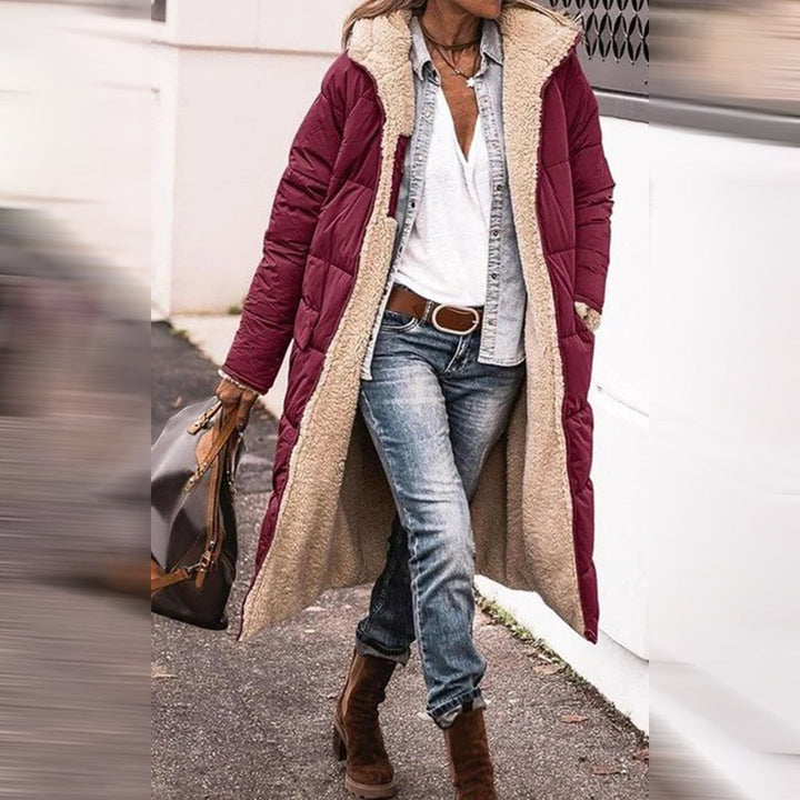 Warm & elegant Nova long women's winter coat. Stylish ladies outerwear, perfect for cold weather outdoor fashion.