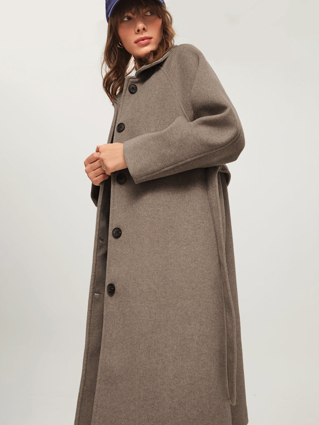 Warm long women's coat, ideal for winter. Cozy & elegant fashion outerwear, a must-have in ladies' cold-weather collection.