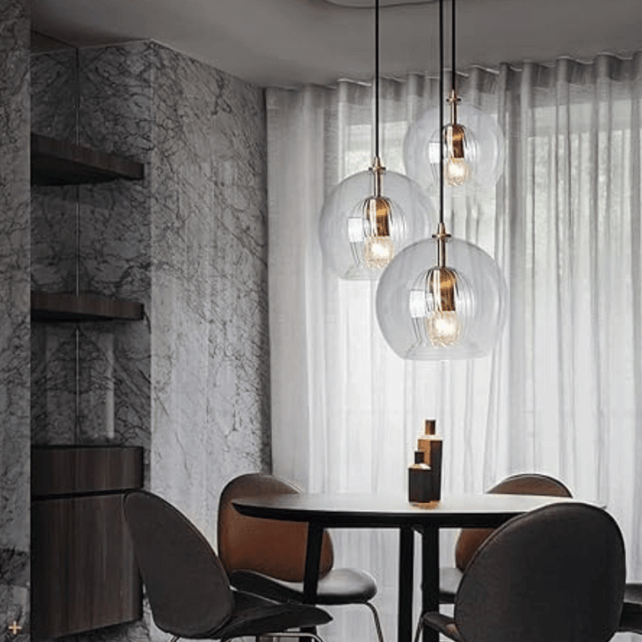 Versatile modern pendant lamp, adjustable, aluminum, glass, for various home spaces and decor.