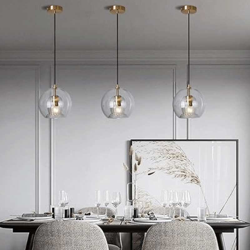 Close-up: LumaLite adjustable pendant lamp, showcasing modern aluminum & glass details.