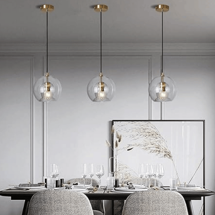 Close-up: LumaLite adjustable pendant lamp, showcasing modern aluminum & glass details.