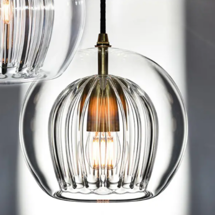 LumaLite modern living room pendant lamp, adjustable and stylish aluminum-glass design.