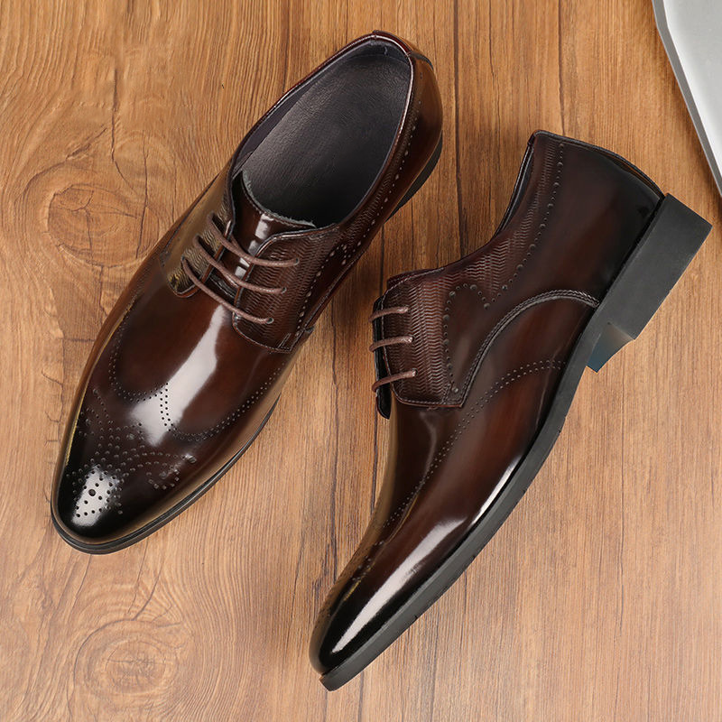 Premium leather men's brogue dress shoes with intricate detailing for a polished, sophisticated formal look.