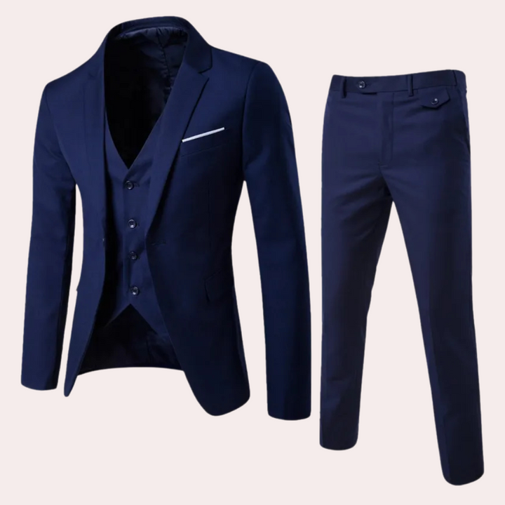 Modern men's slim fit three-piece suit, elegant formal fashion for sophisticated events. Tailored for a sharp silhouette.