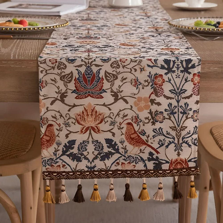 Vintage style jacquard table runner featuring a charming floral bird motif, ideal for dining tables.