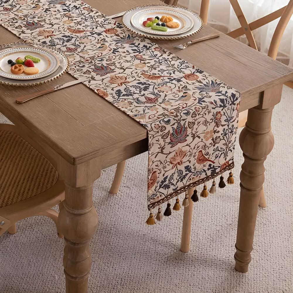 Dining table runner with intricate floral and bird design, bringing country charm to any home decor.