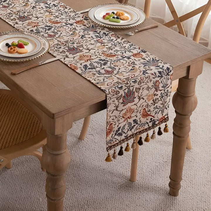 Dining table runner with intricate floral and bird design, bringing country charm to any home decor.