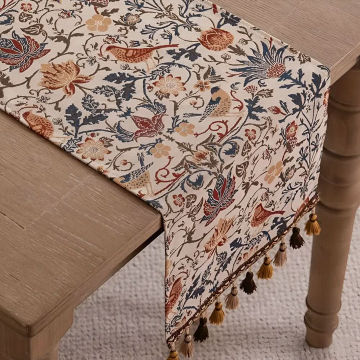 Decorative table linen: elegant floral bird motif table runner, perfect for vintage or country-themed dining.