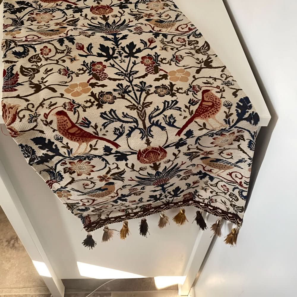 Dining decor: elegant table runner with detailed floral bird motif, adding a touch of vintage style to your table.