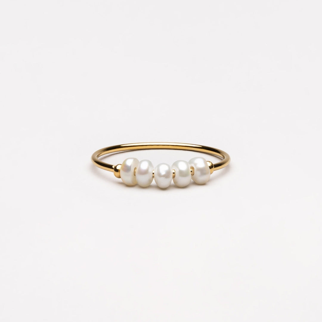 Elegant mini pearl ring for women, featuring dainty freshwater pearls on a delicate band.