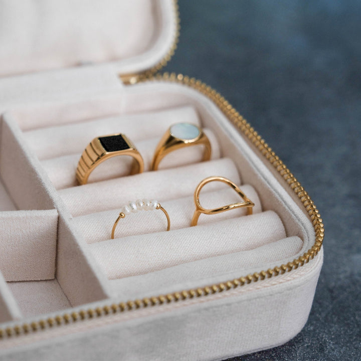 Women's dainty gold pearl ring with mini freshwater pearls, a classic and trendy jewelry piece.