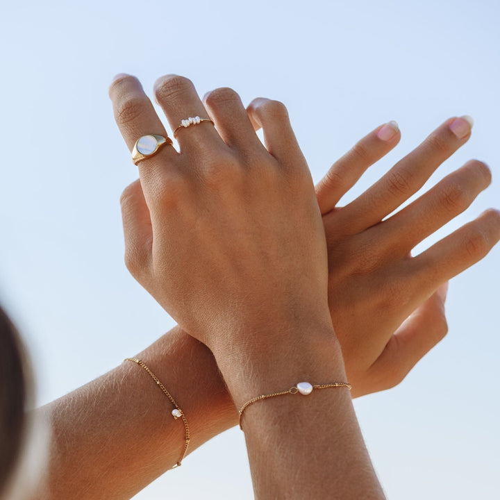 Small freshwater pearl ring for women, 'Isolde' style, adding a touch of elegance to any outfit.