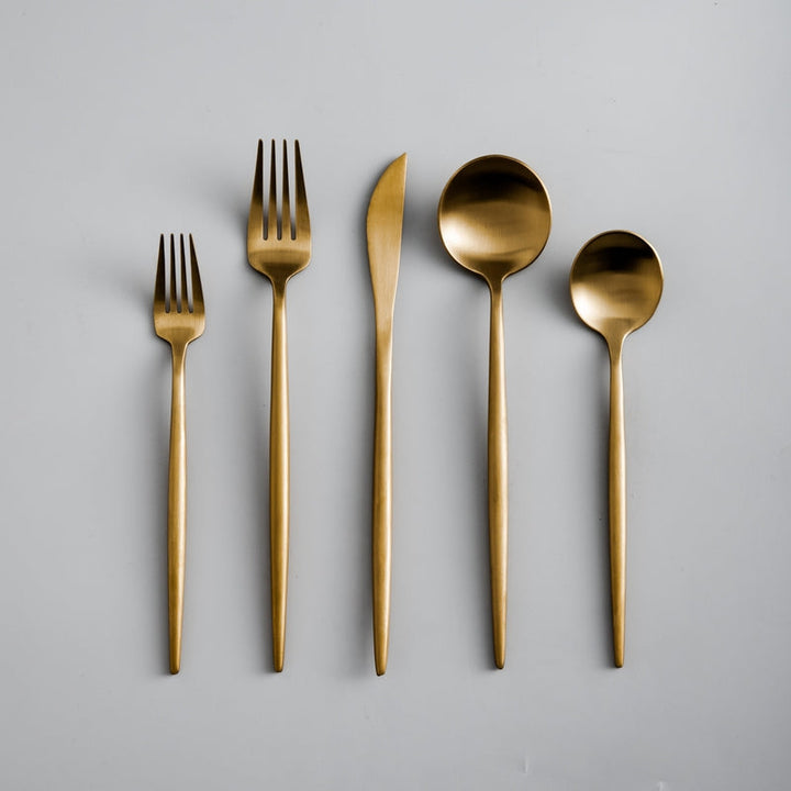 Elegant modern minimalist flatware set for dining, a key kitchen essential.