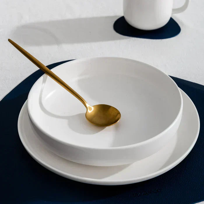 Modern dining flatware set, showcasing minimalist design & matte finish.