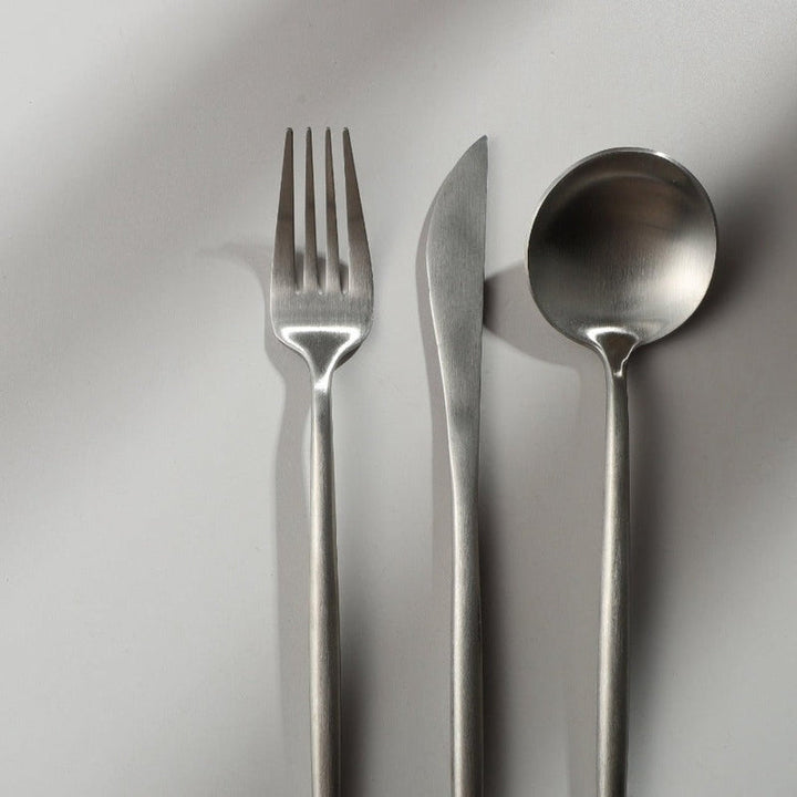 Elegant flatware set, modern minimalist design perfect for any dining style.