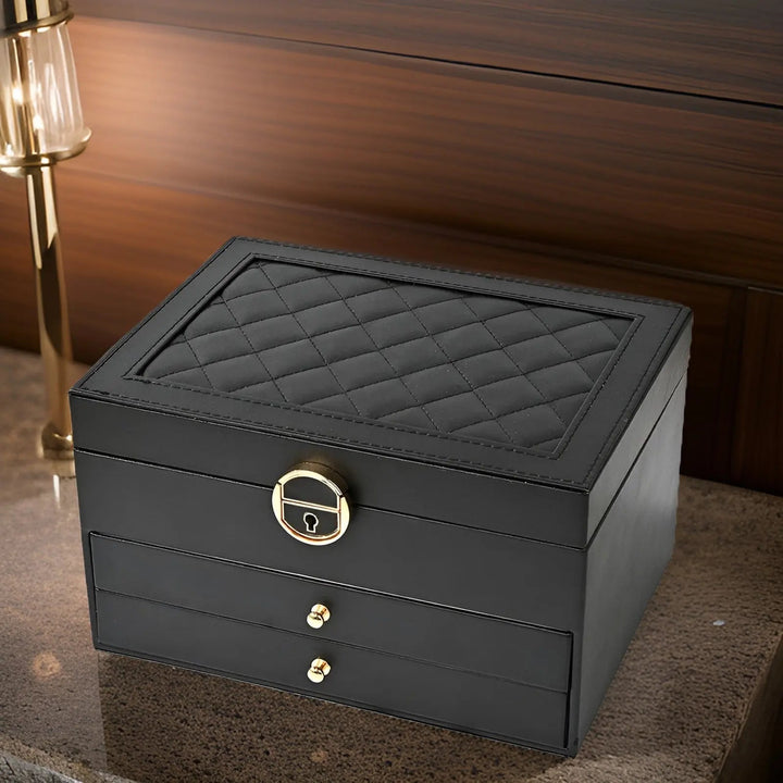 Open multi-layered jewelry box revealing compartments for rings, necklaces, and other women's accessories.