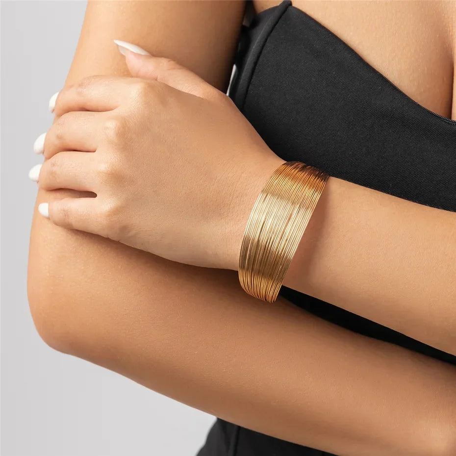 Delicately crafted silver multi-strand bracelet, a stylish and stackable women's jewelry piece.