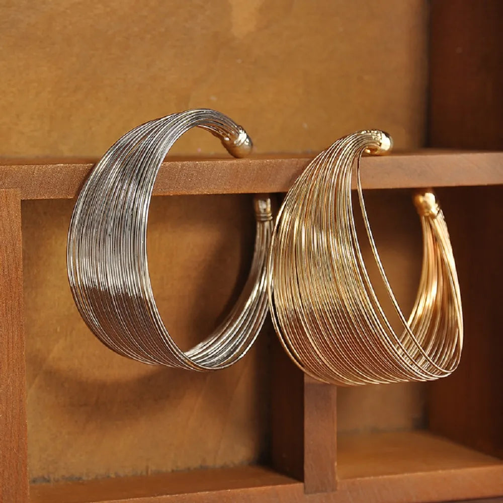 Women's multi-strand bracelet in gold or silver. Elegant, fashionable, and stackable jewelry.