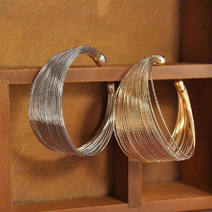 Women's multi-strand bracelet in gold or silver. Elegant, fashionable, and stackable jewelry.