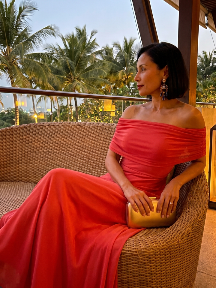 Stylish green off-shoulder midi dress with draped details, perfect elegant formal wear for women.