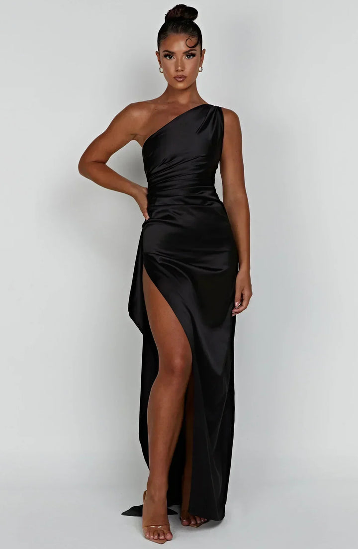 Flowing women's one-shoulder satin split gown, an elegant choice for any special event.