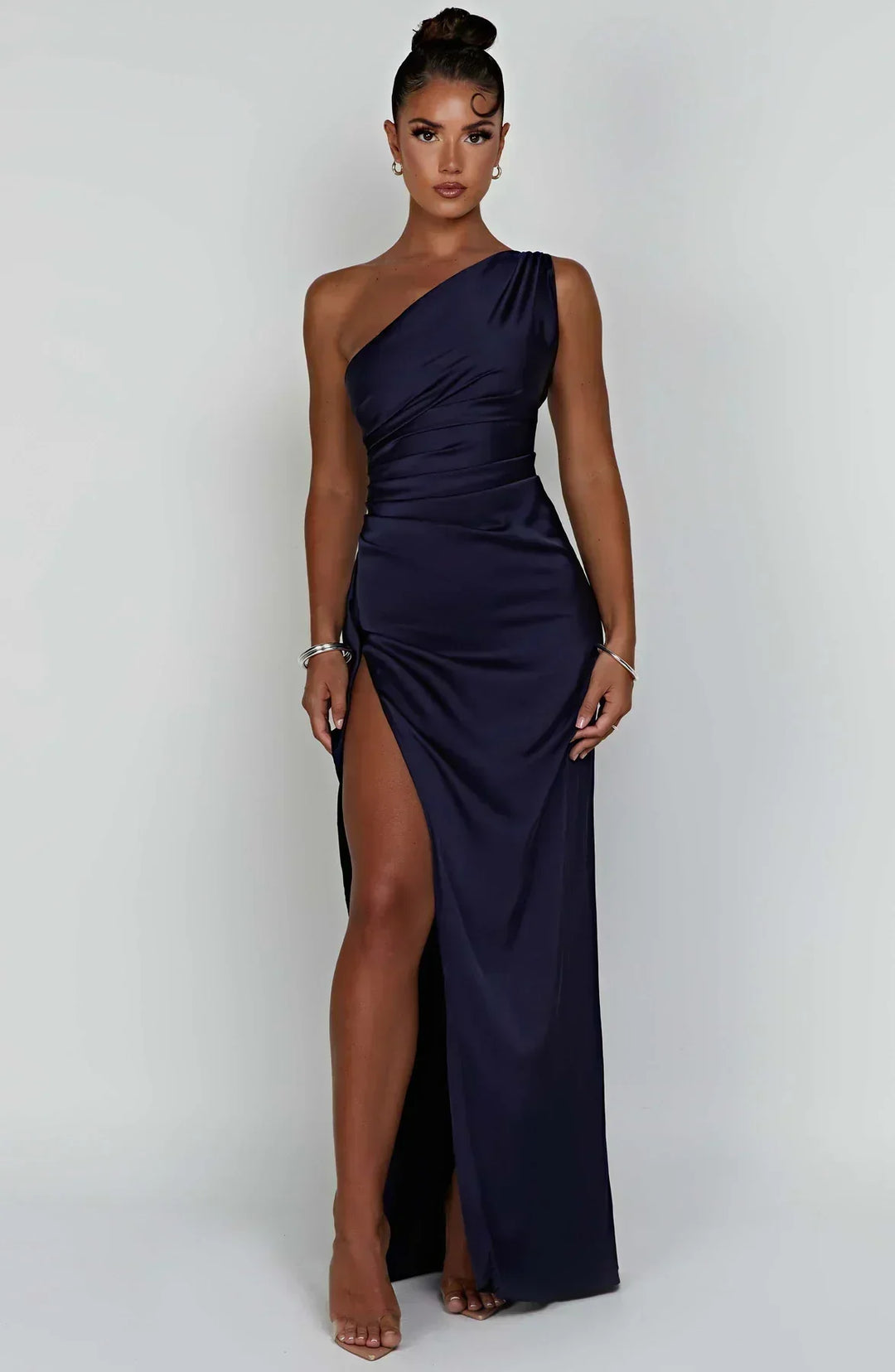 Modern women's one-shoulder party dress with an elegant split, perfect for special events.
