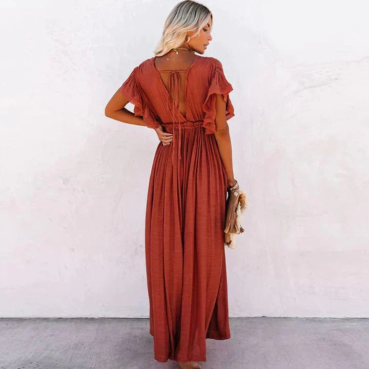 Women's elegant orange long maxi dress, perfect for beach, resort, or stylish summer events.