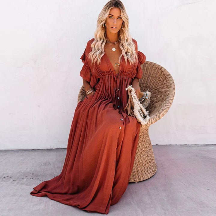 Flowy long orange beach dress for women, elegant & comfortable for summer vacations & resort.