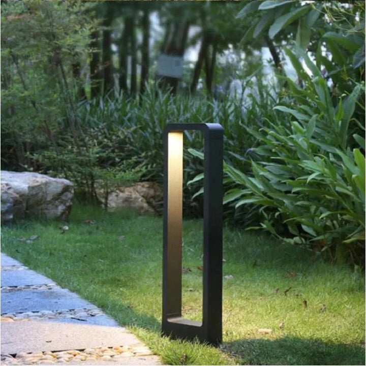Grey housing LED garden bollard light, waterproof outdoor ground lamp for modern landscape and path lighting.