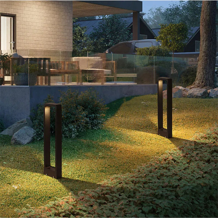 Modern outdoor LED bollard light, grey waterproof ground lamp ideal for garden pathways and landscape lighting.