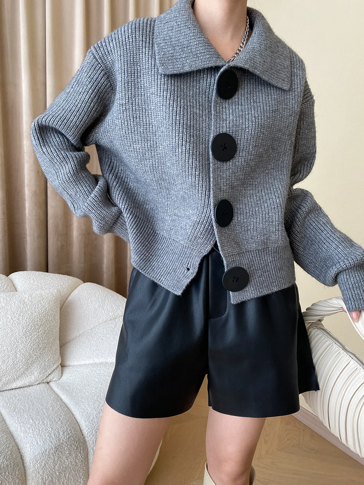 Cozy women's oversized button-down cardigan, perfect for elegant layering in cooler weather.