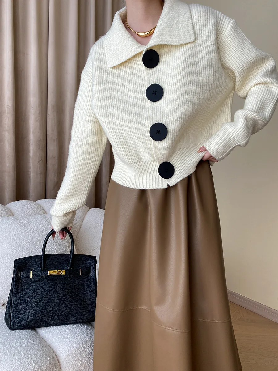 Fashionable women's oversized button-down cardigan with wide collar, great for layering.