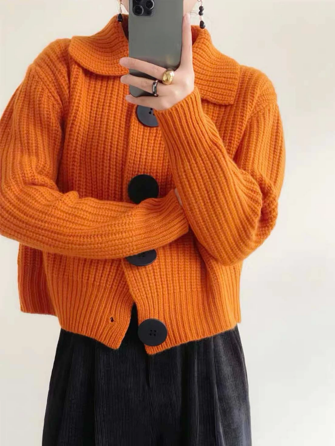 Statement oversized button-down cardigan for women, ideal for chic winter outfits.