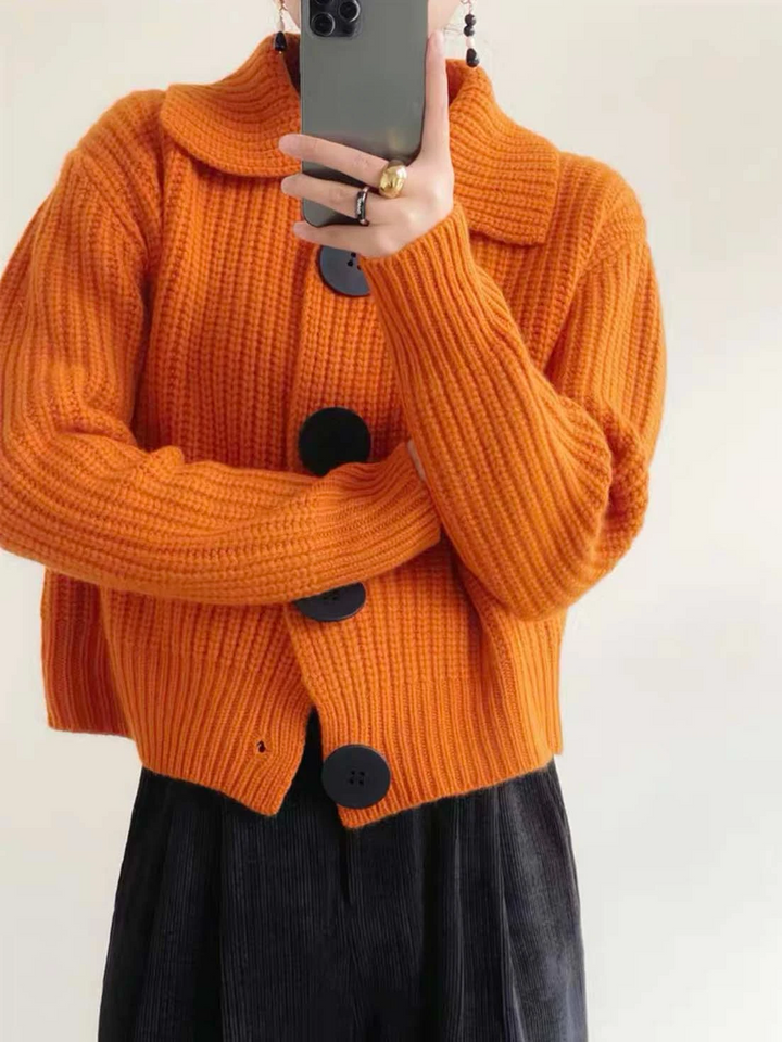 Statement oversized button-down cardigan for women, ideal for chic winter outfits.