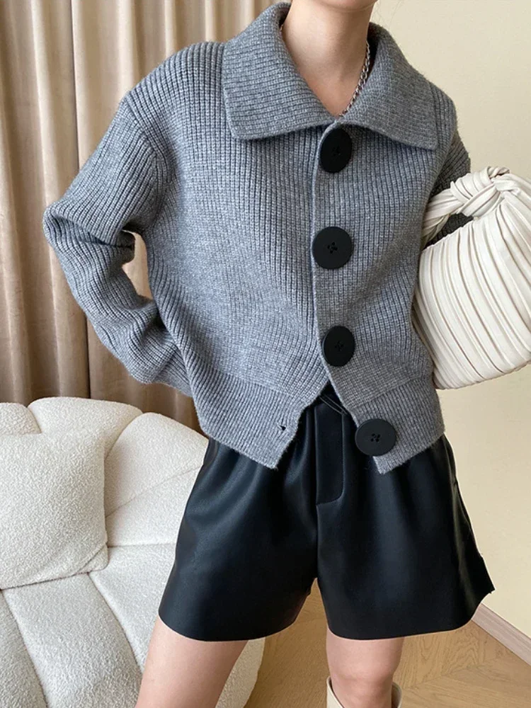 Versatile women's oversized button-down cardigan, comfortable and chic layering piece.