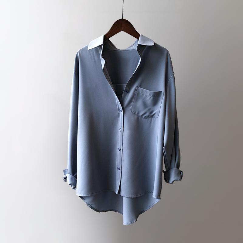 Sophisticated women's pearl black flowing blouse, ideal for office wear, providing an elegant and professional look.