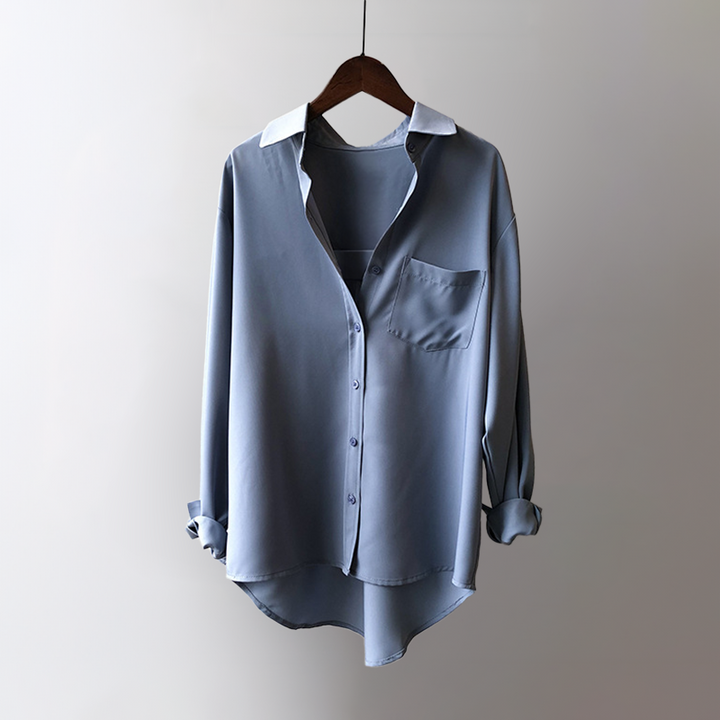 Sophisticated women's pearl black flowing blouse, ideal for office wear, providing an elegant and professional look.