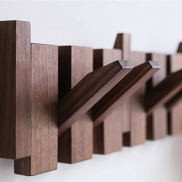 Modern black & white piano key design wall mounted coat rack, offering stylish organization.