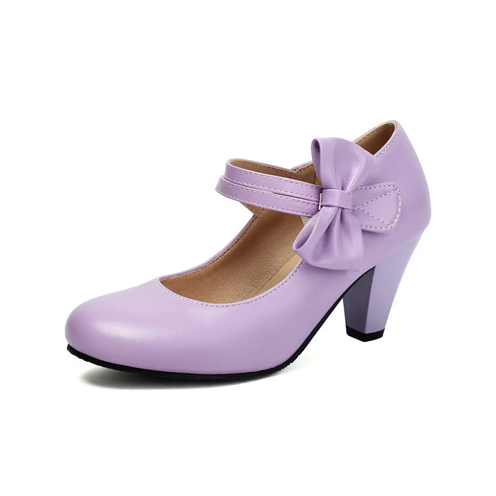 White party block heels for women, featuring an elegant bow and ankle strap for formal events.