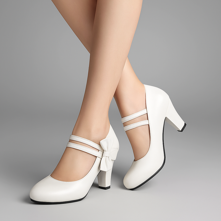 Comfortable purple block heels featuring an elegant bow detail and sturdy design for all-day wear.