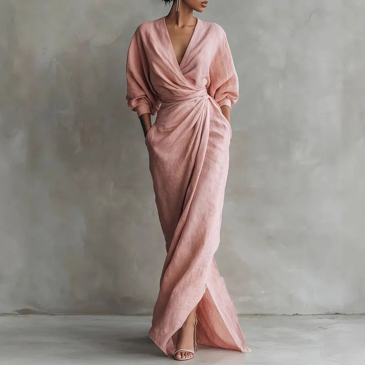 Elegant pink V-neck wrap maxi dress with long sleeves, perfect for women's evening wear or sophisticated casual.