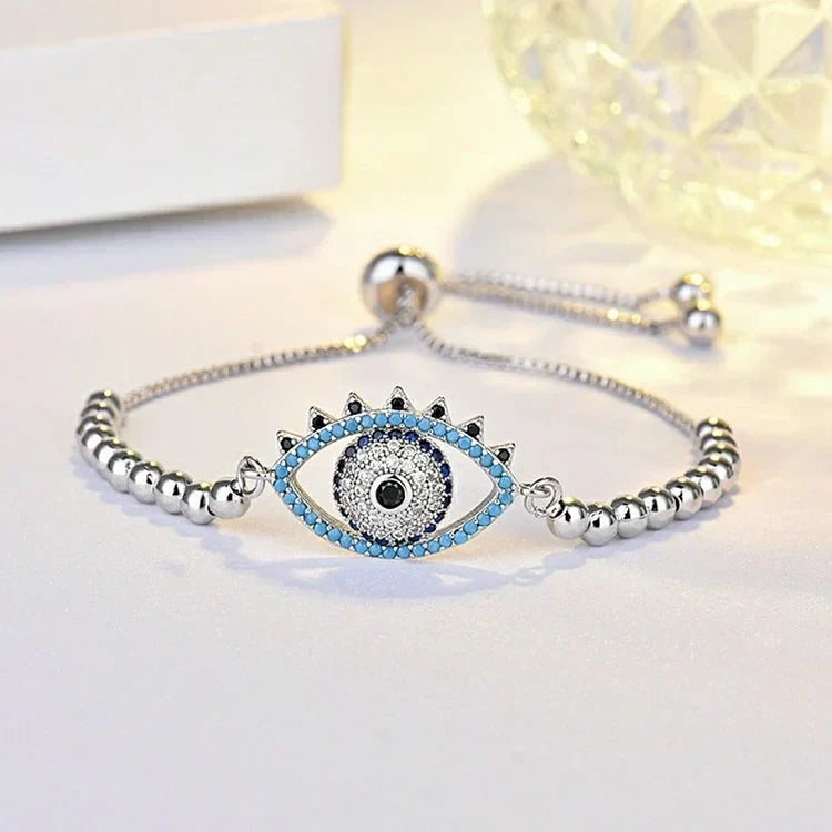 Women's spiritual silver evil eye bracelet, designed for protection. A beautiful talisman accessory for daily wear.