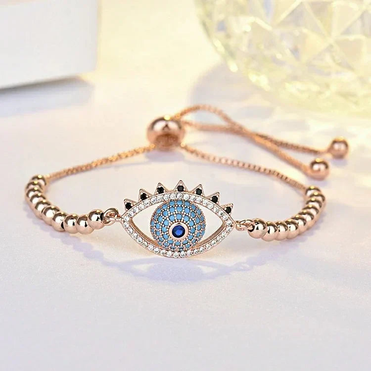 Chic rose gold evil eye bracelet for women, offering spiritual protection & a touch of elegance. Perfect as a gift.