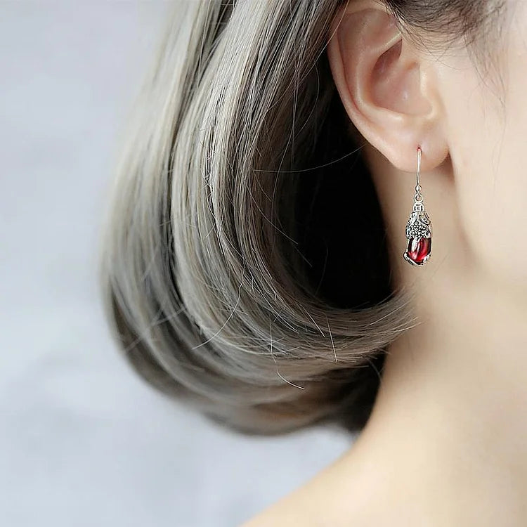 Elegant S925 silver mythical creature stud earrings for women, featuring a unique fantasy design & sparkling crystals.