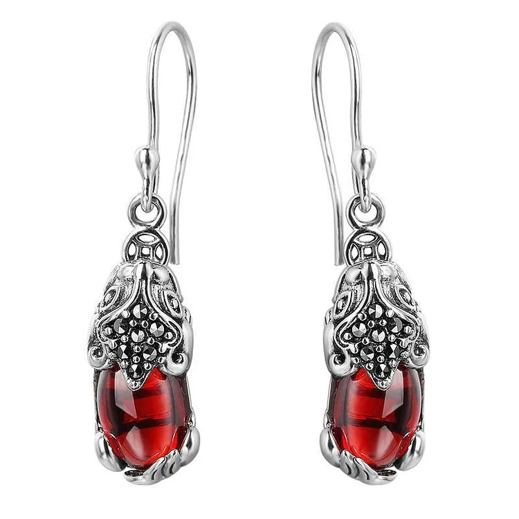 Unique Aelora mythical creature silver stud earrings for women, perfect fantasy jewelry gift with crystal accents.