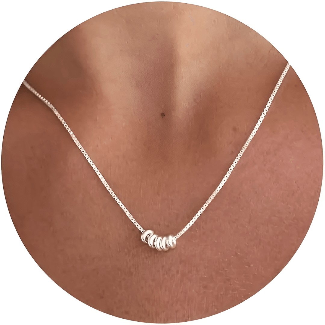 Stylish silver plated Seraphina charm necklace, an elegant women's fashion statement piece. Ideal for gifts.