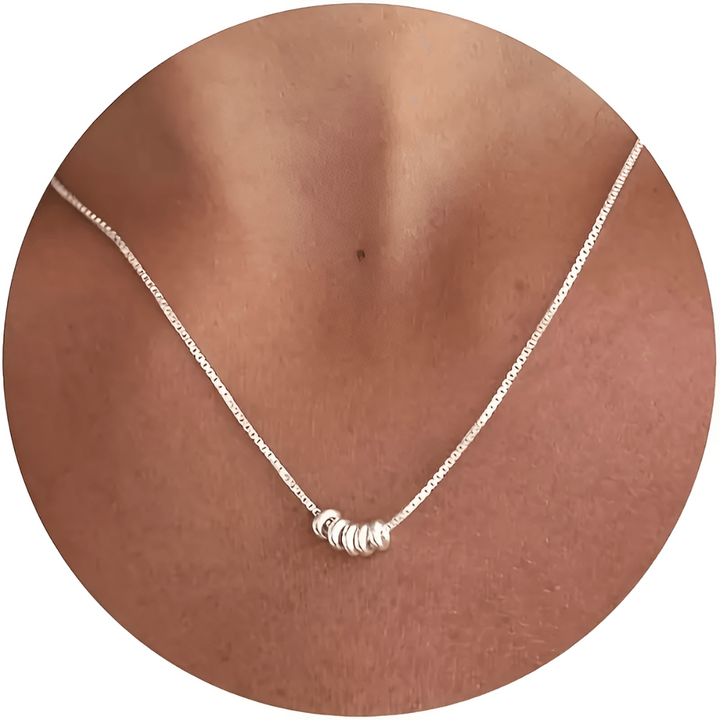 Stylish silver plated Seraphina charm necklace, an elegant women's fashion statement piece. Ideal for gifts.