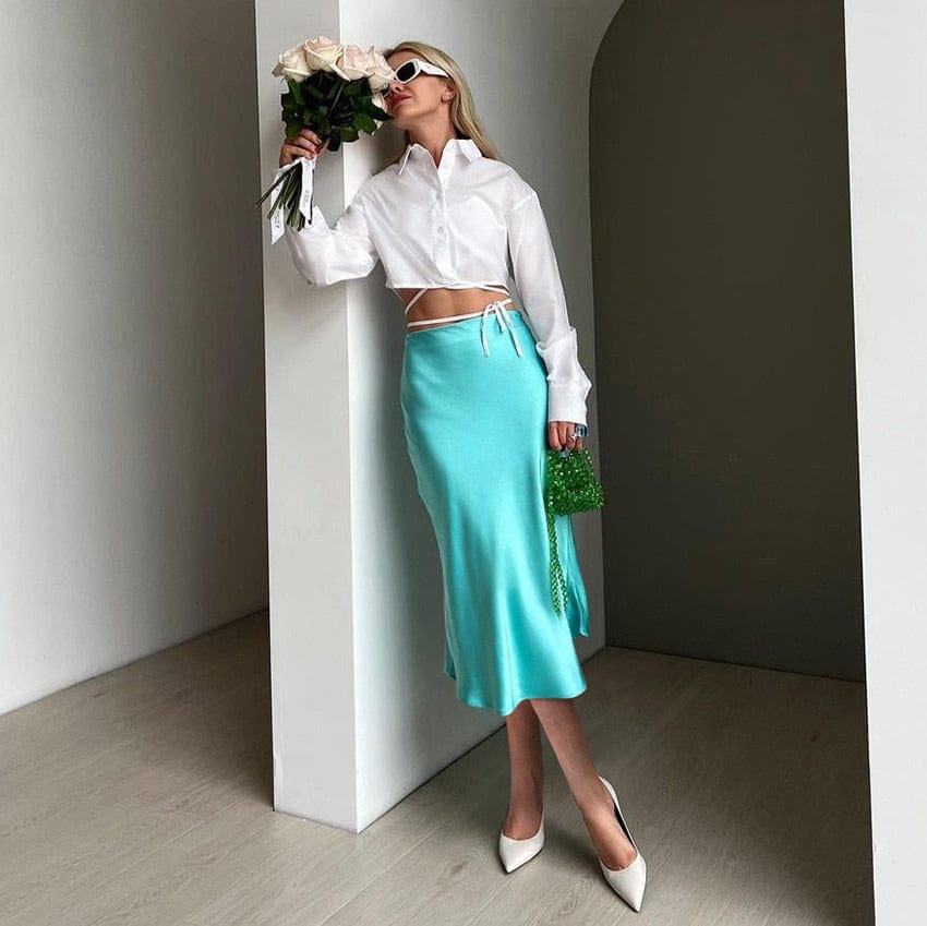 Chic high-waist A-line midi skirt for women. Shimmering fabric, a stylish spring/summer fashion essential.